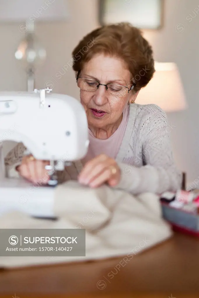 A senior woman sewing