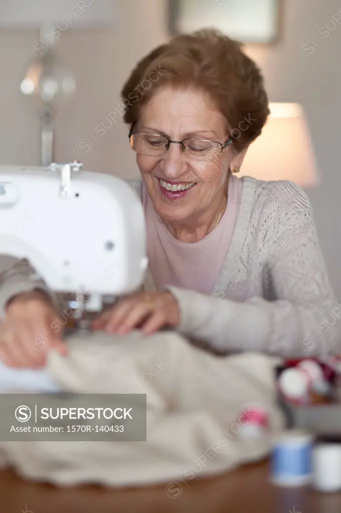 A senior woman sewing