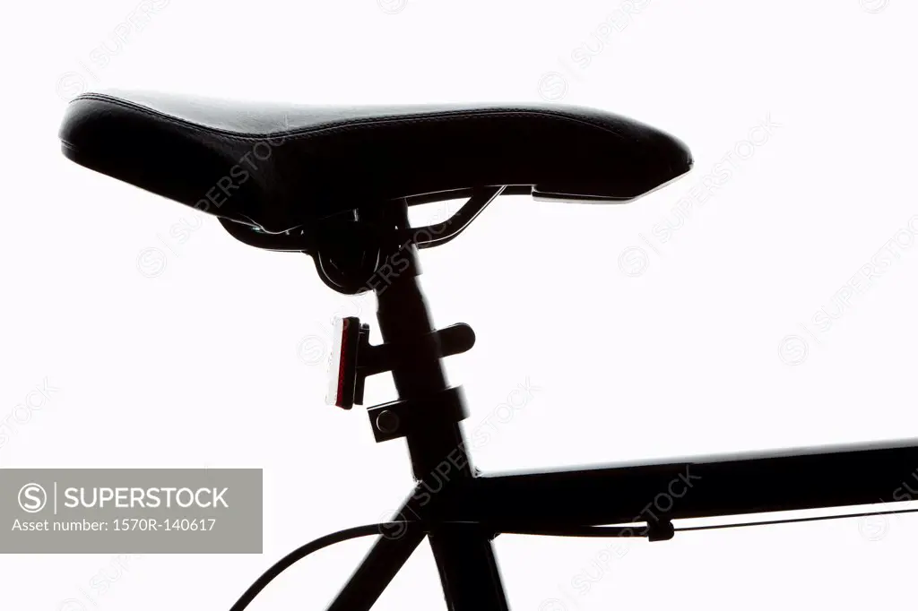 Detail of a bicycle seat, back lit, studio shot