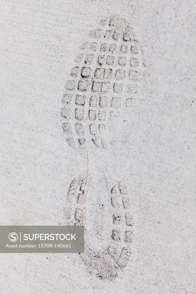 Imprint of a sports shoe in concrete