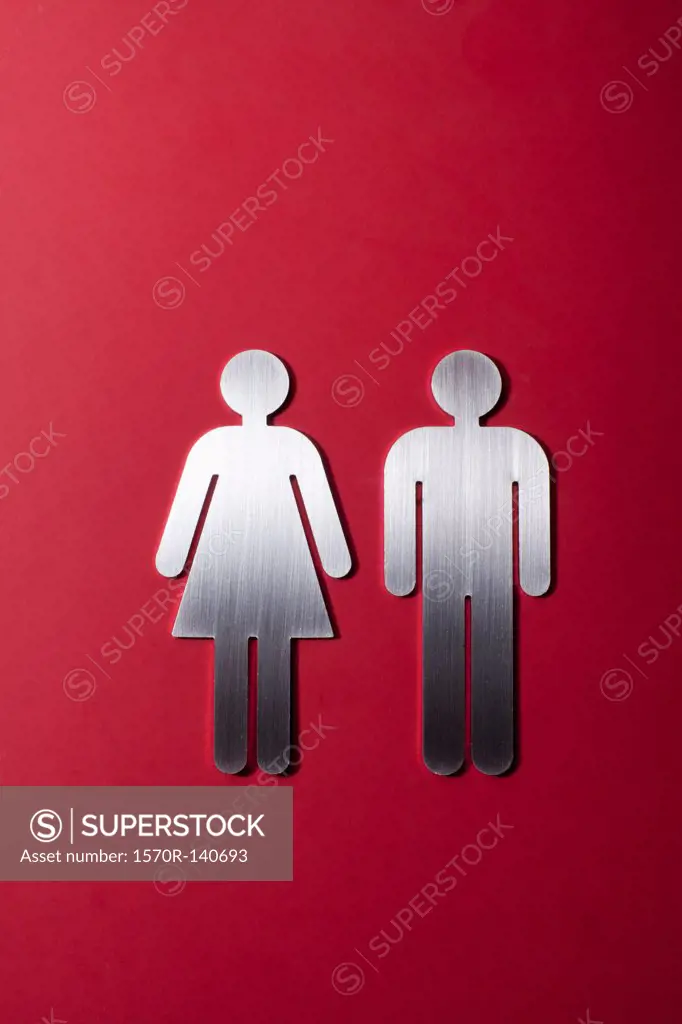 Female and male restroom sign figures side by side