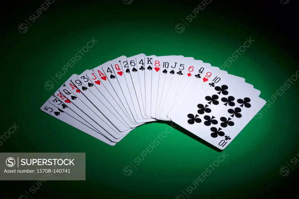Cards fanned out on a gambling table