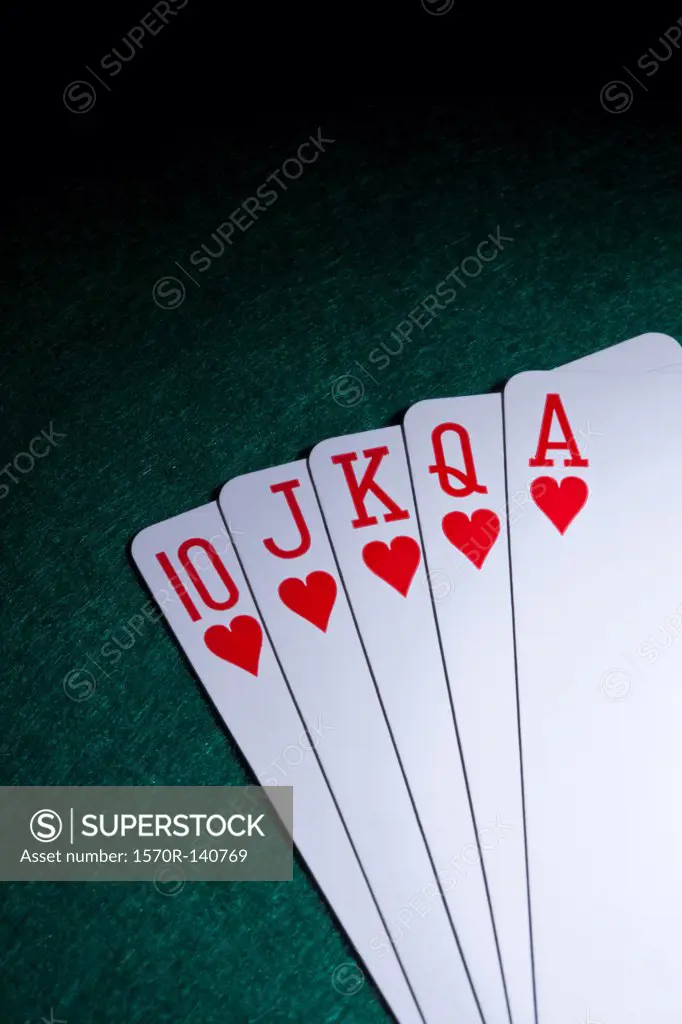 A straight flush fanned out on a table