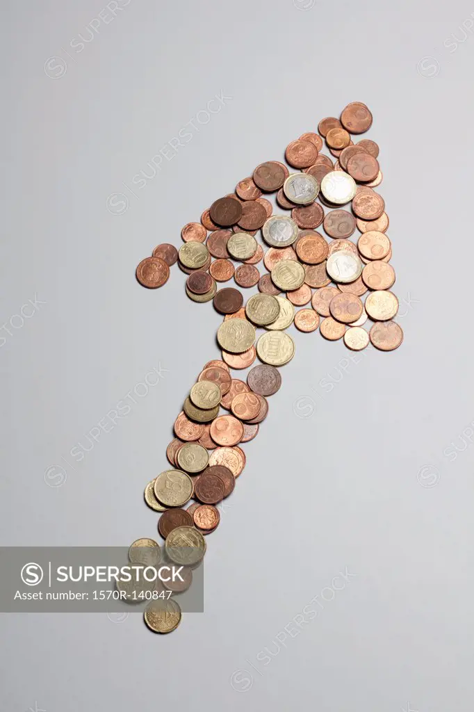 European Union coins arranged into the shape of an arrow pointing up