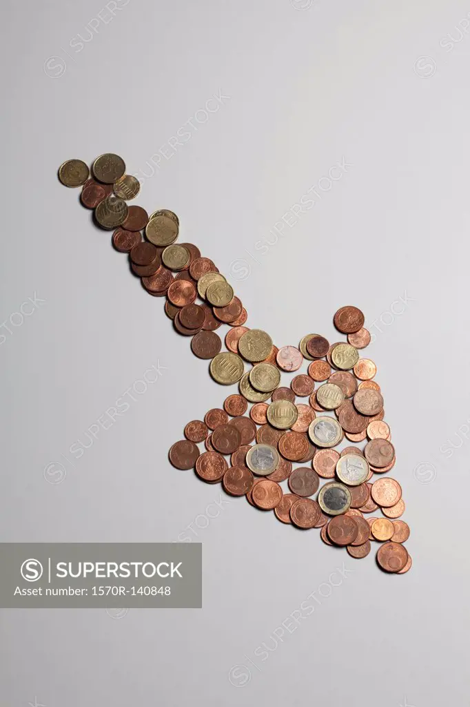 European Union coins arranged into the shape of an arrow pointing down