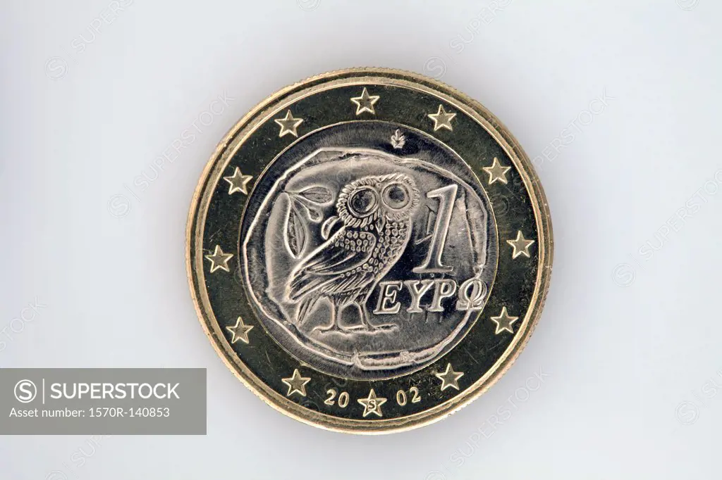 Rear view of a one Euro coin with an owl representing Athena and an olive branch
