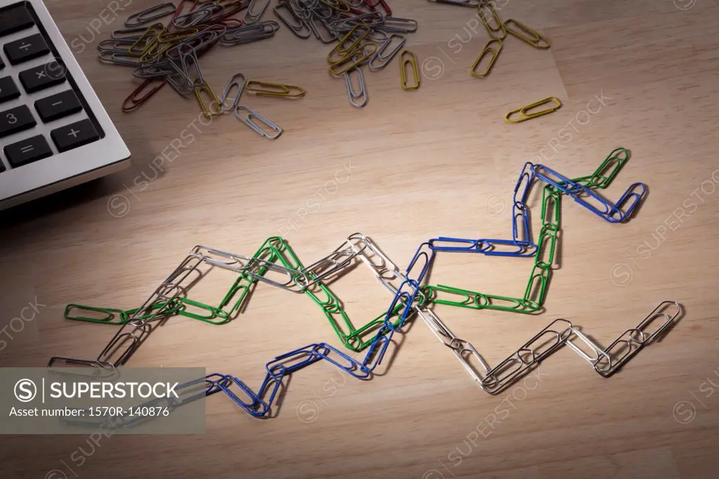 Paperclips arranged to look like lines on a line graph