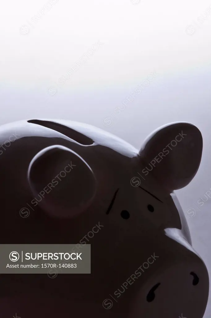A piggy bank with raised eyebrows indicating worry