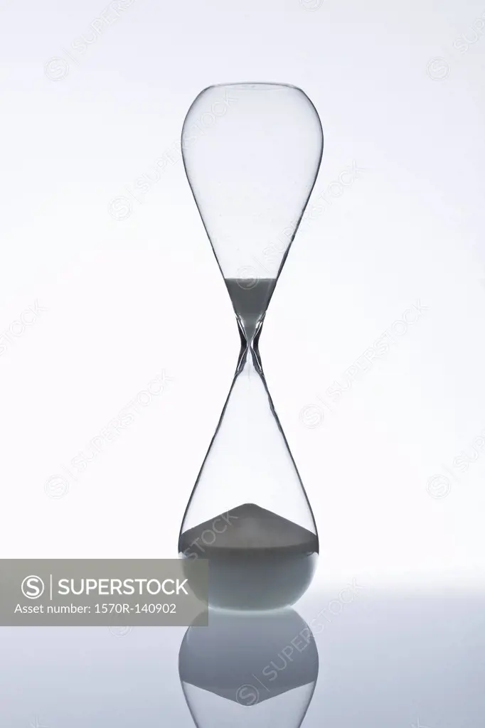 Sand running through an hourglass