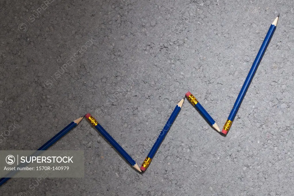 Pencils arranged to depict an ascending line graph