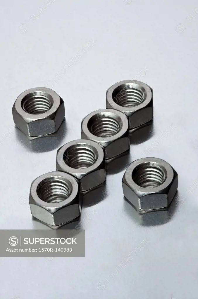 Metal nuts arranged in a pattern