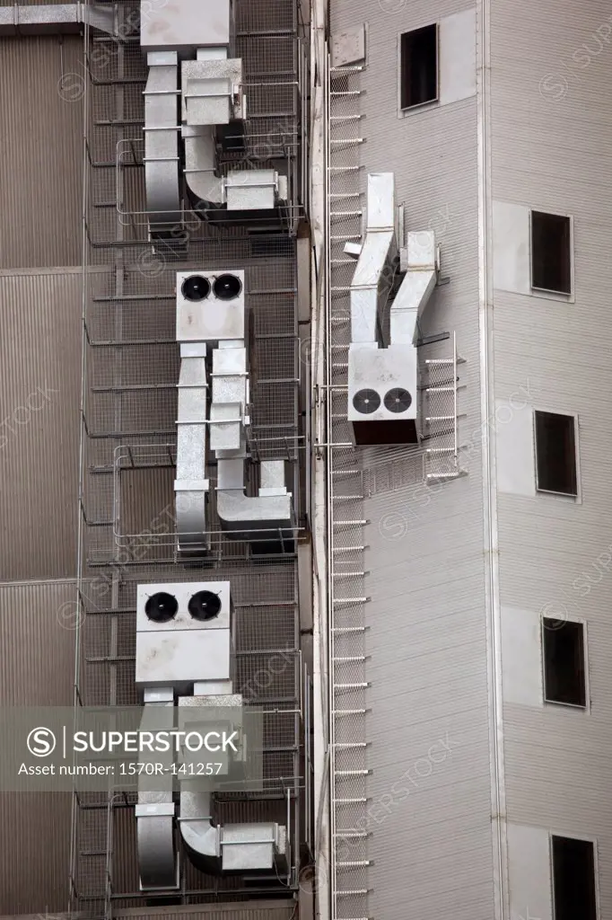 Anthropomorphic air vents on side of building