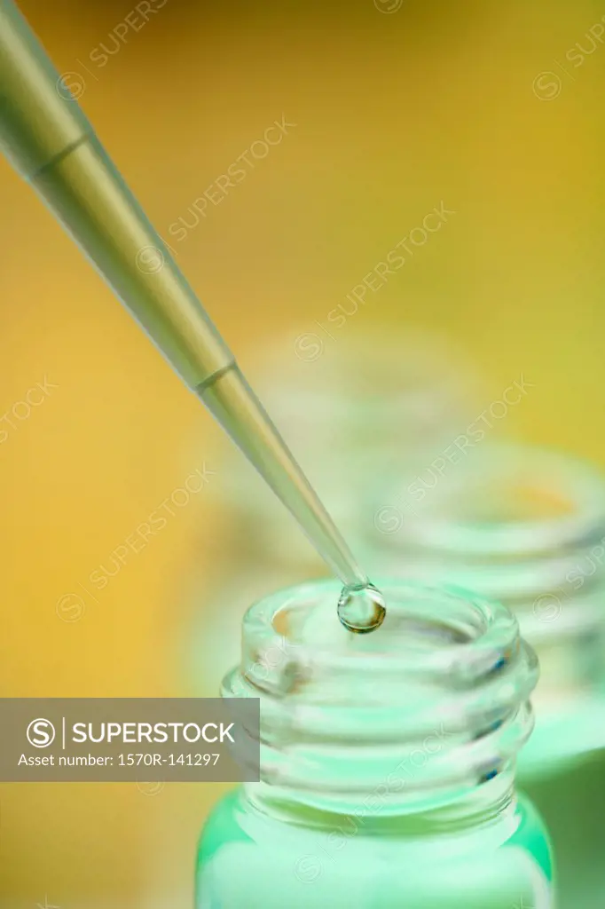 Pipette droplet over lab jar