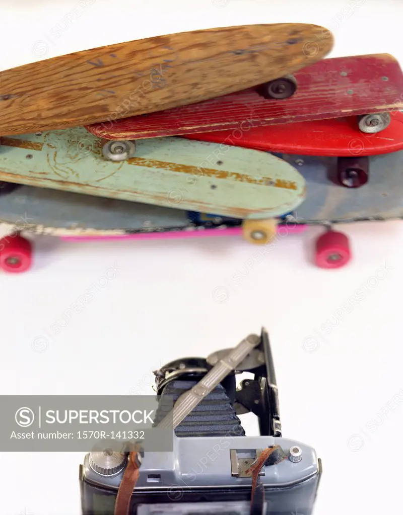 A large format camera and skateboards in a photo studio