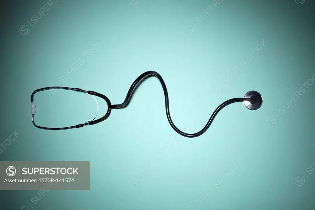 A stethoscope on a green background