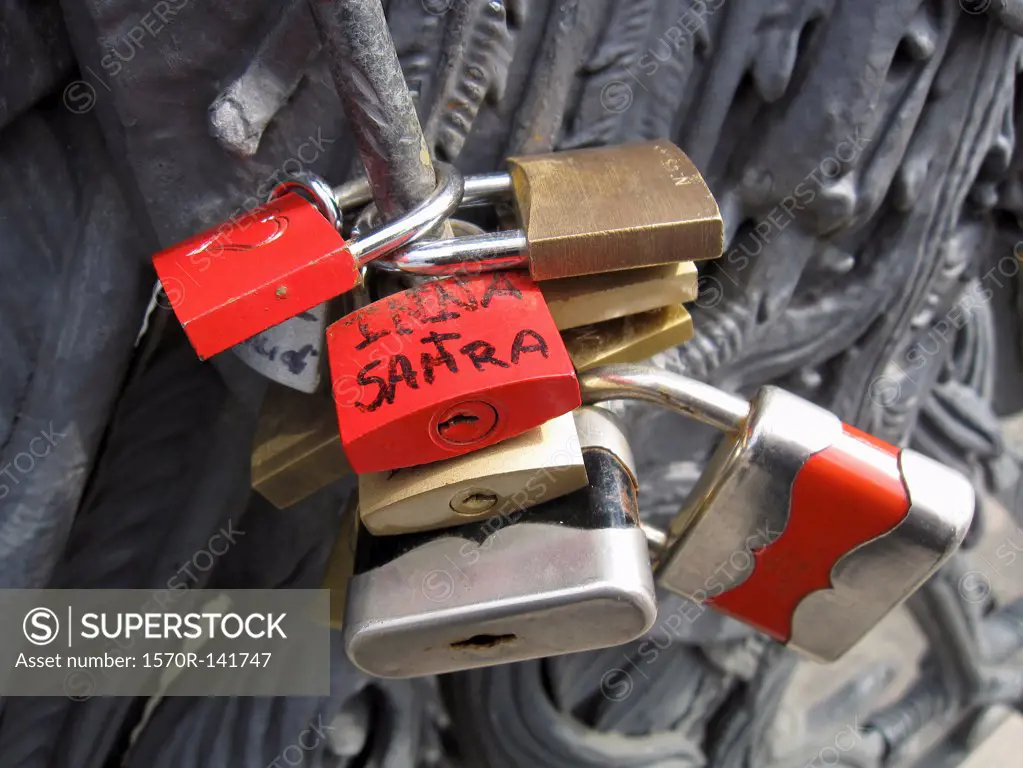 Lovelocks of passion on a bridge, attached by couples as a symbol their devotion