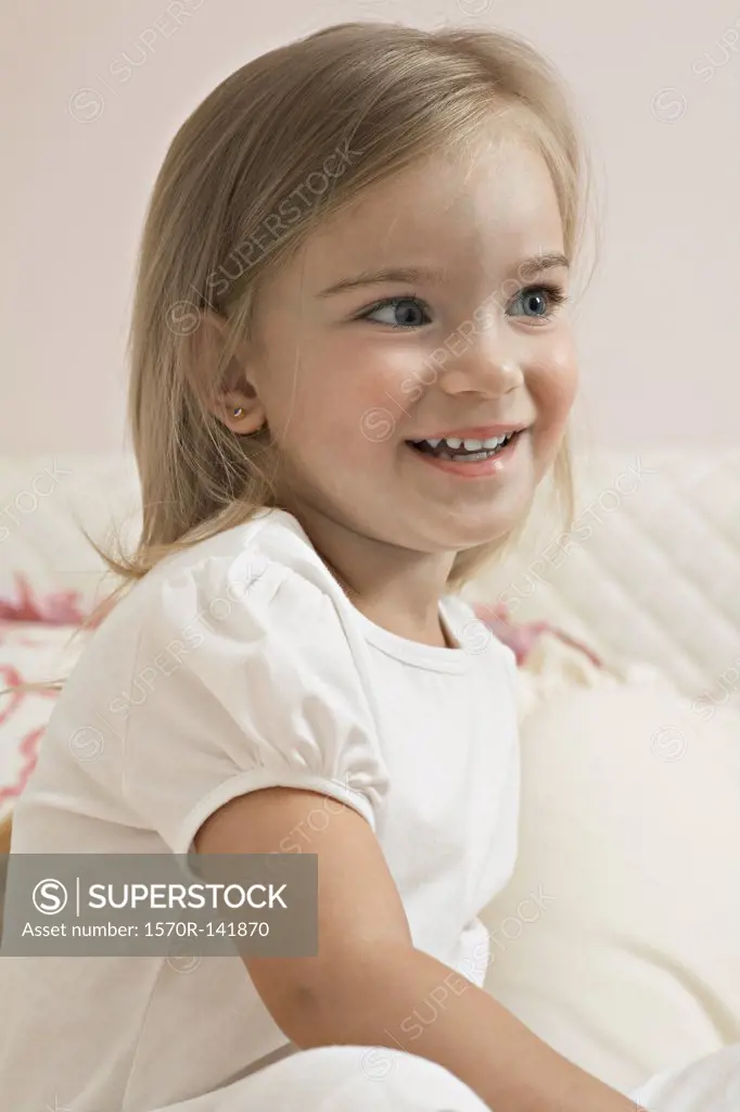 A young cheerful girl looking away