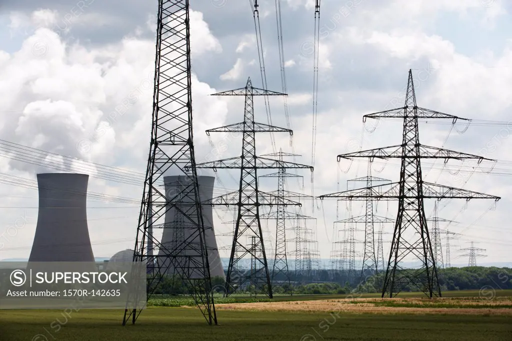 Electricity pylons in front of a nuclear power station, Grafenrheinfeld, Germany