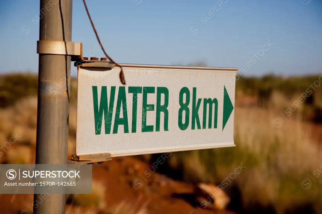 An arrow sign for WATER in 8km
