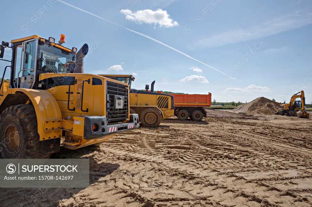 Construction vehicles on work site