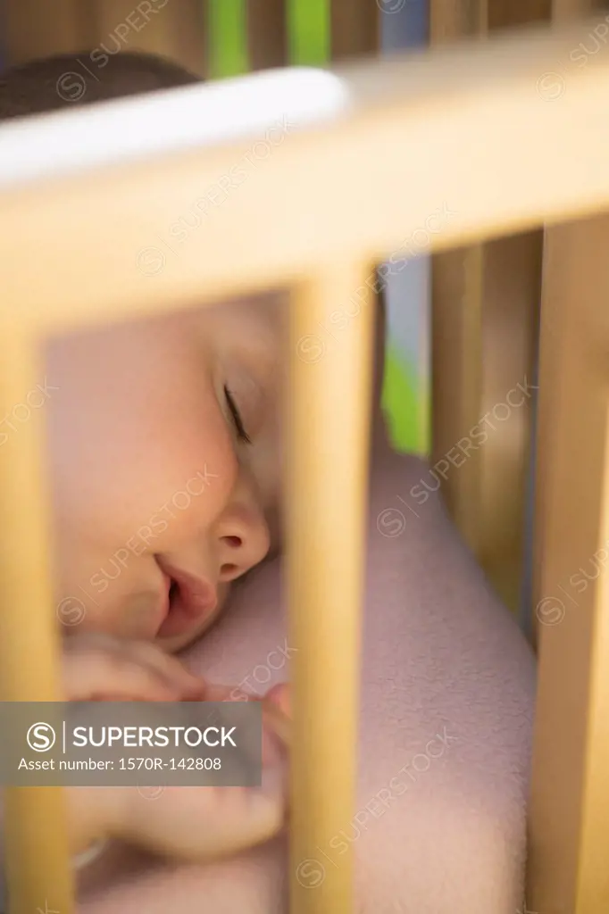 Baby seeping in crib outside