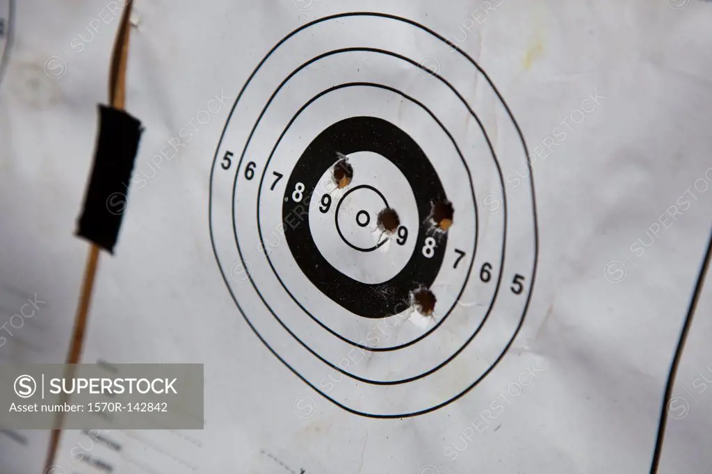 Bullet holes on a paper target