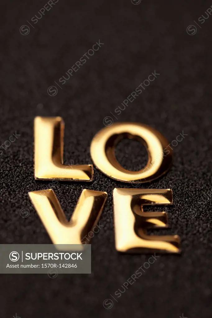 Single word 'love' in gold lettering