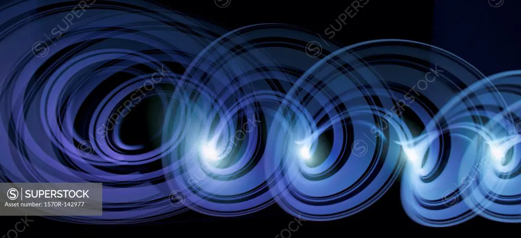 Blue purple light trails creating an abstract spiral pattern