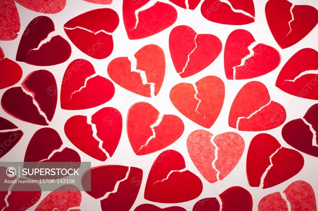 A bunch of red tissue paper broken hearts