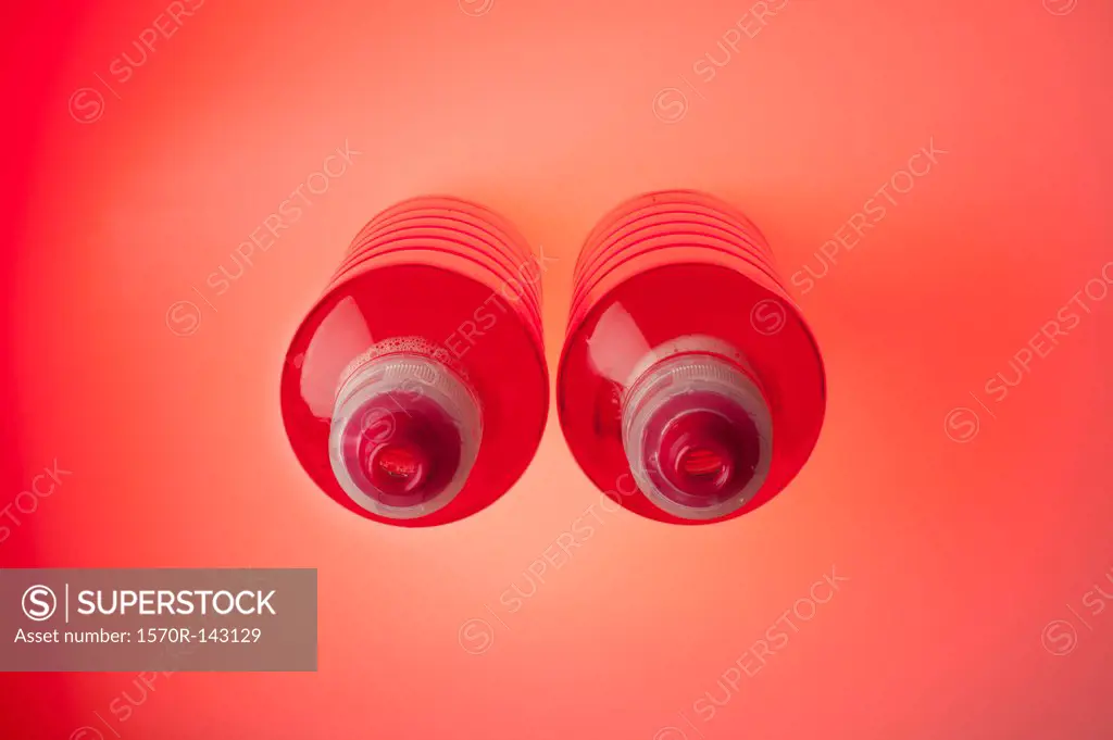Two sport drink bottles arranged to look like a pair of breasts