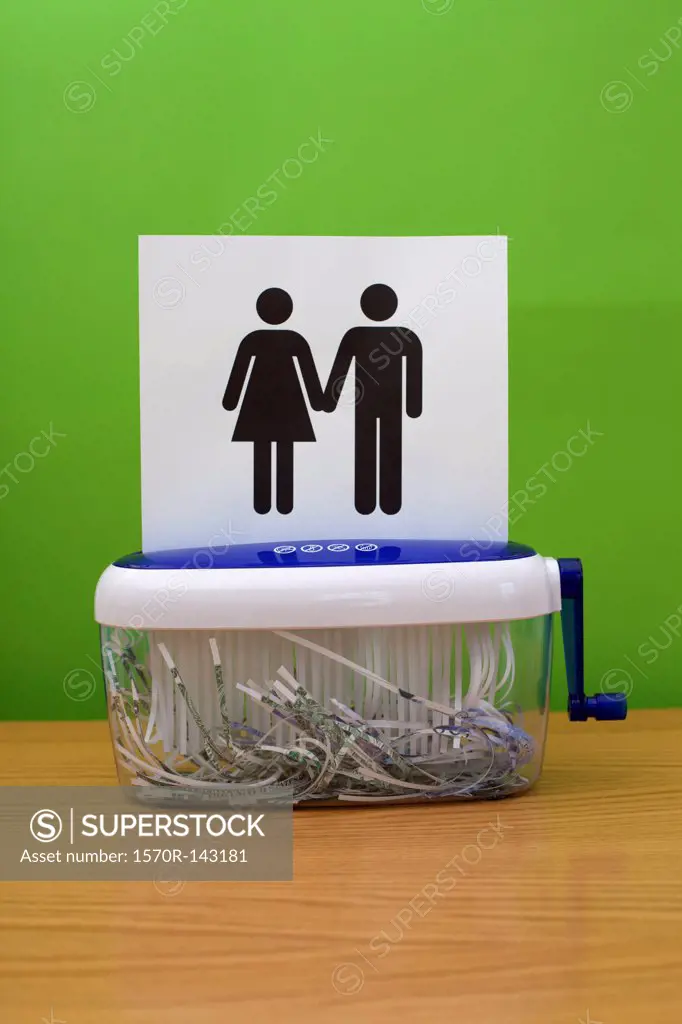 Gender symbols holding hands, about to be shredded