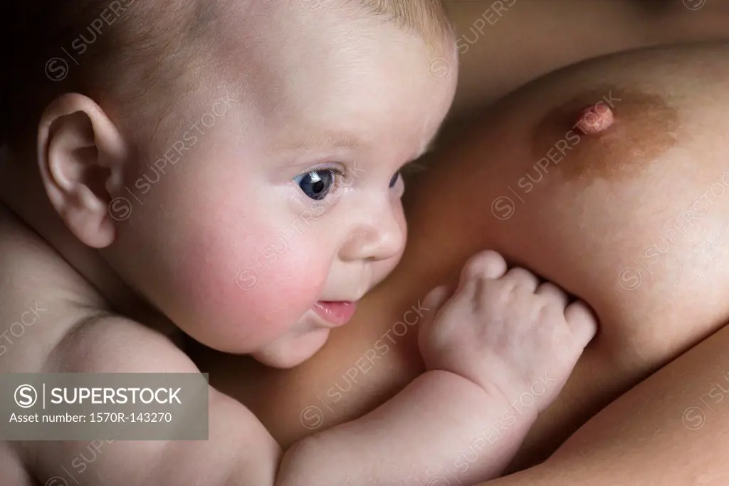 Daughter on mother's breast