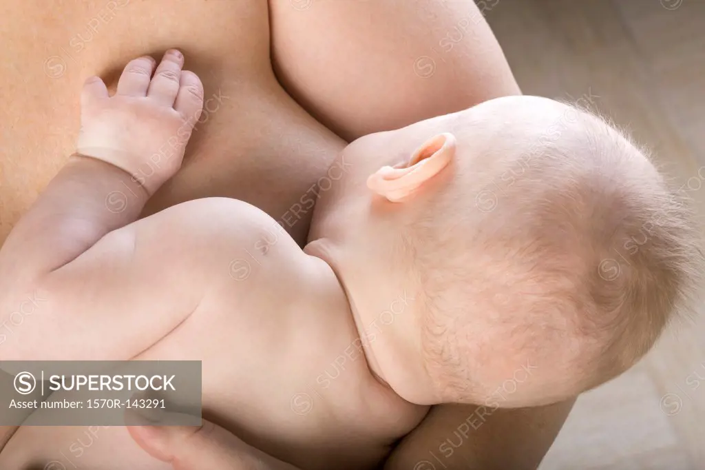 Mother breastfeeding her son