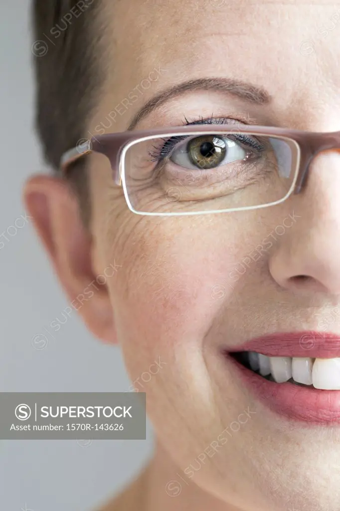 Close up of smiling woman with glasses