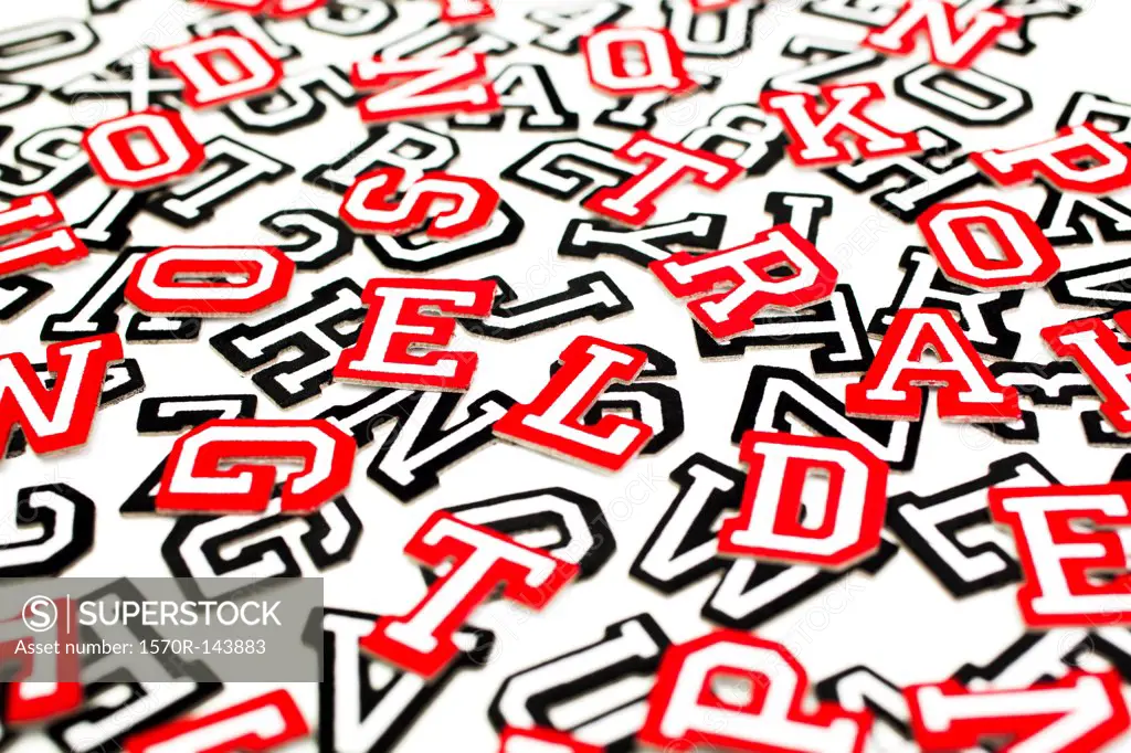 A bunch of varsity font sticker letters and numbers in red and black outline