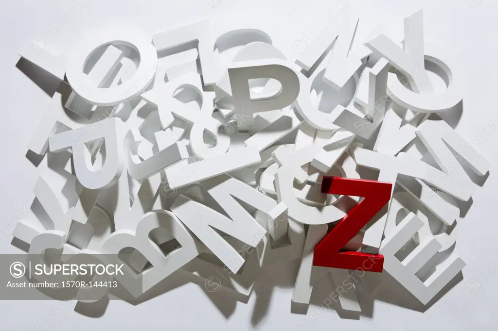 A heap of white block letters with a red letter Z