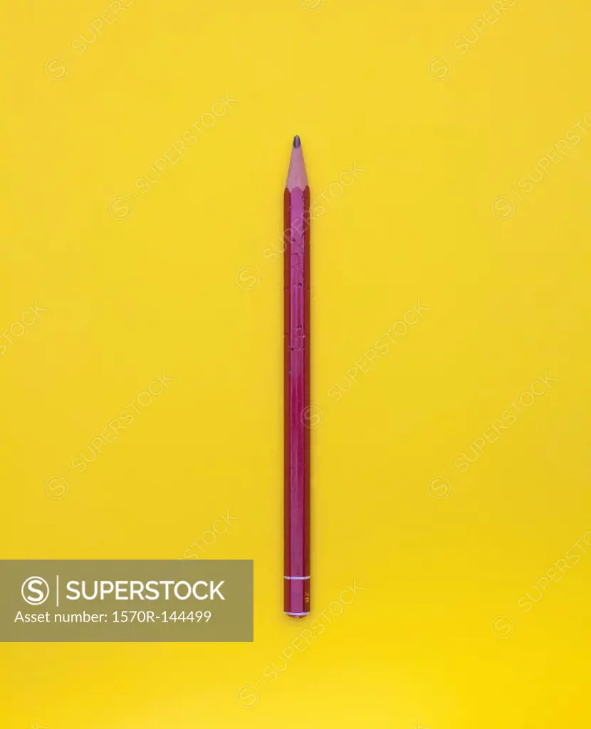 Pencil against yellow background