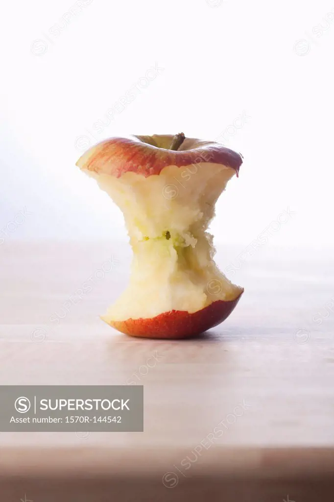 A fresh apple core on a table