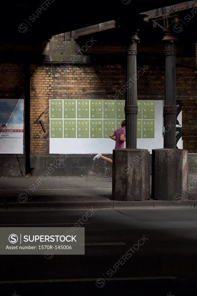 Man jogging on footpath