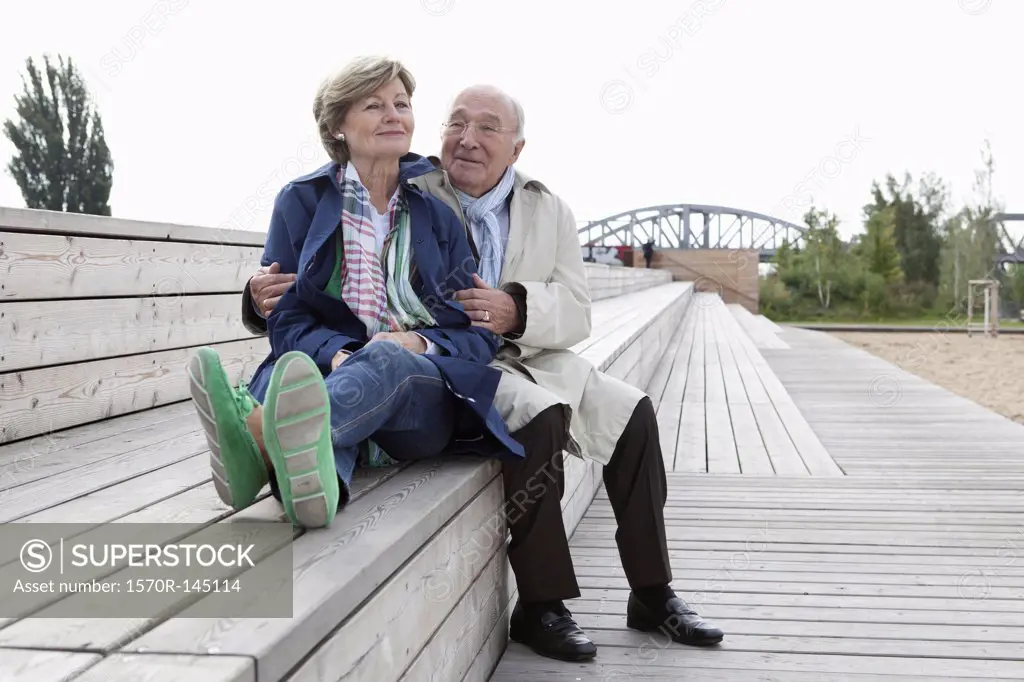 Couple sitting on steps in park