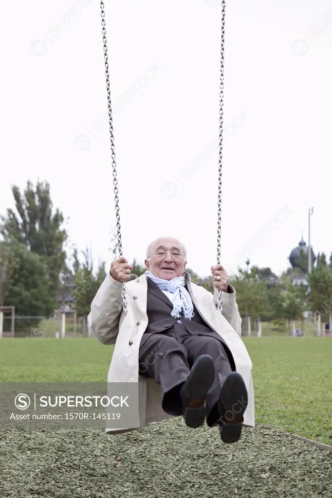Senior man swinging in park