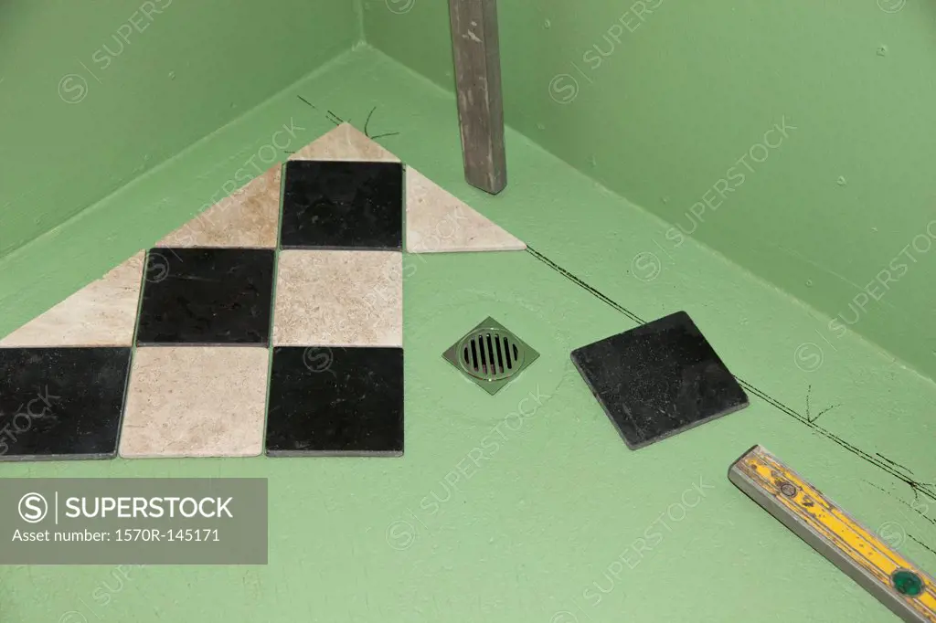 Installing floor tiles