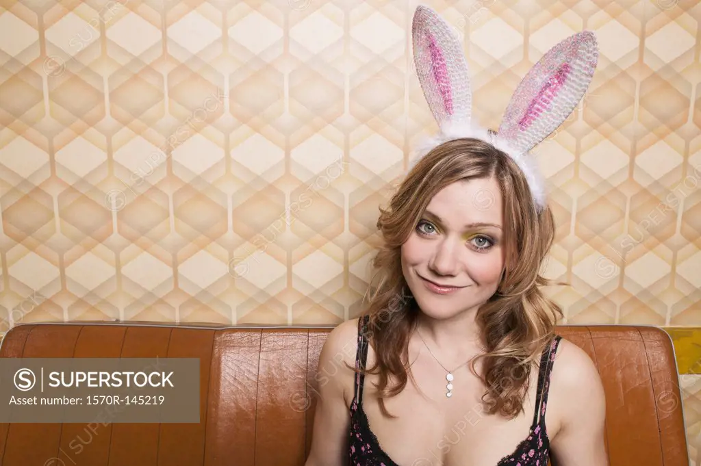 Portrait of a woman with rabbit ears, smiling