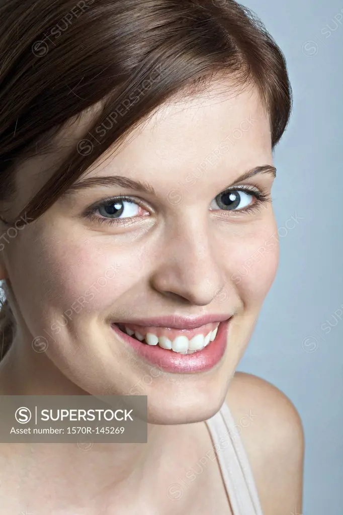 Young woman looking at camera, close-up