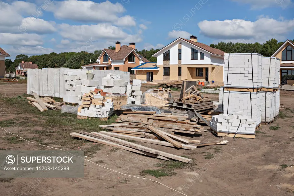 Construction material in front of house