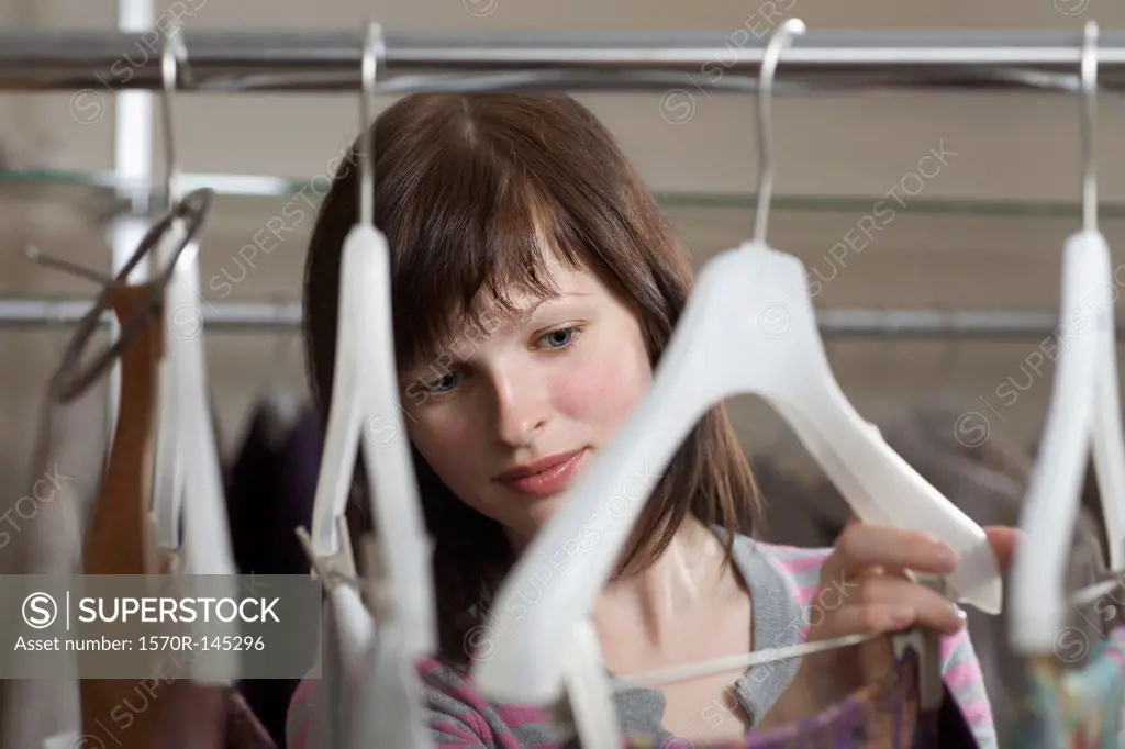 Young woman choosing dress