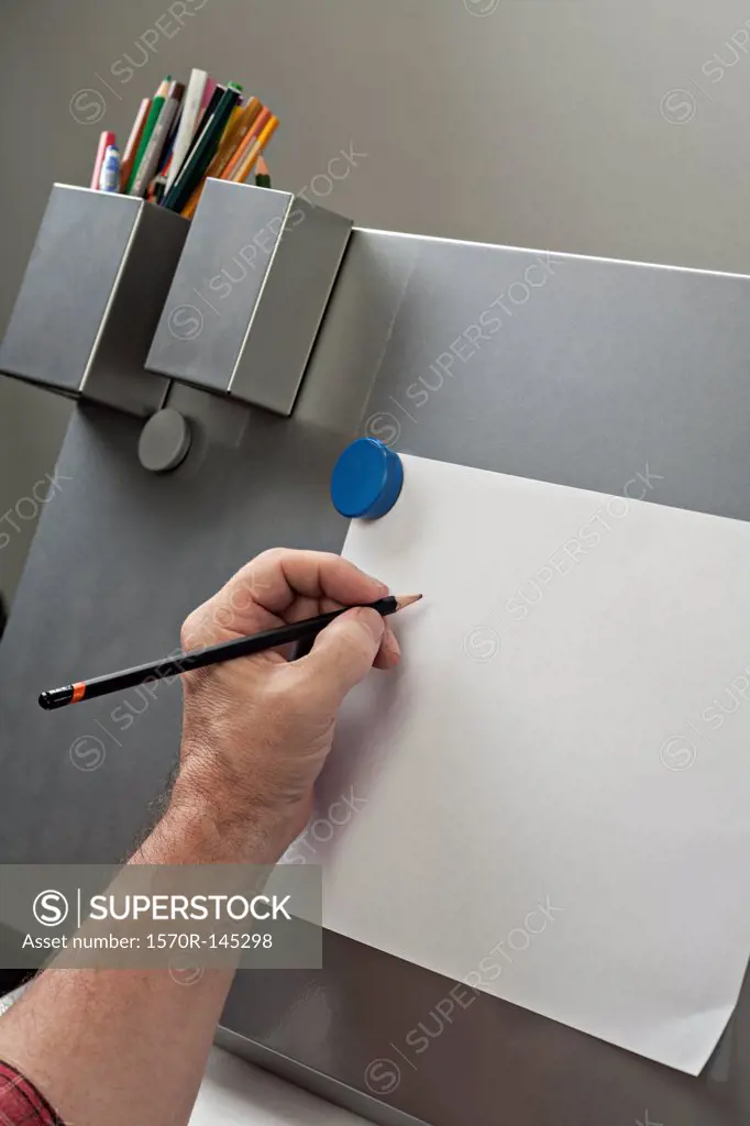 Man drawing on paper
