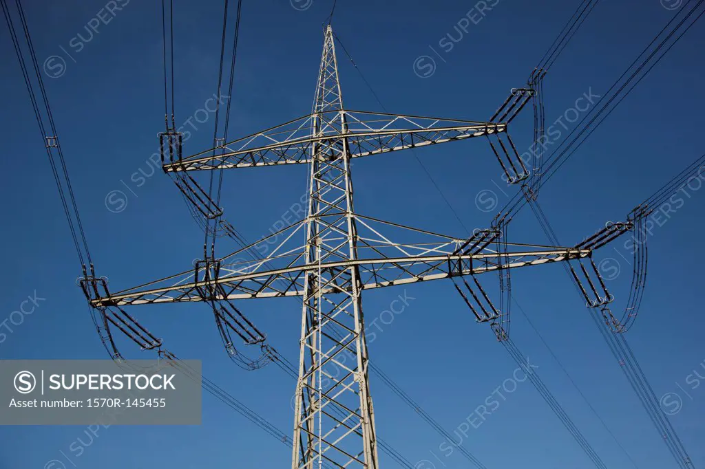 Electricity lines against blue sky
