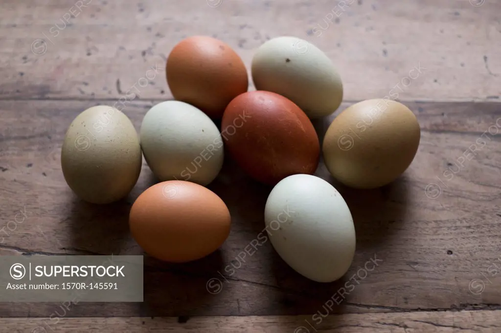 Eggs on wooden table, close-up