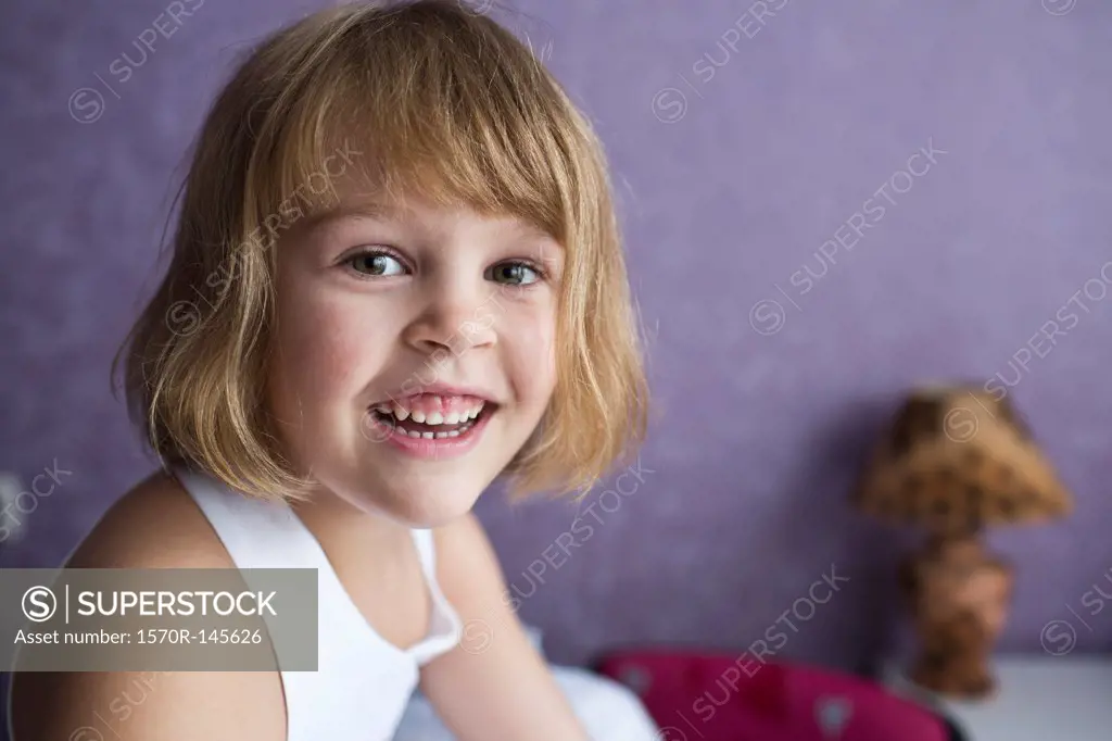 Portrait of girl smiling, close-up